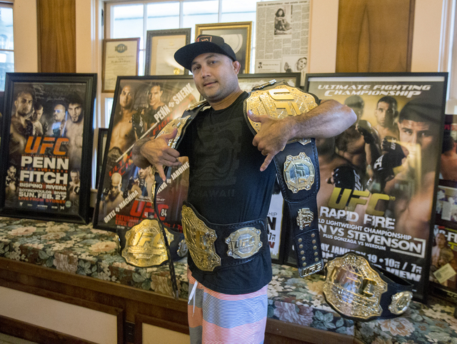 1817486_web1_BJ_Penn_with_UFC_Belts_2.jpg