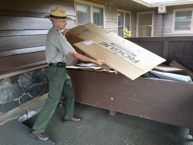 1841809_web1_Ranger-recycling-cardboard-at-Kilauea-Visitor-Center.jpg
