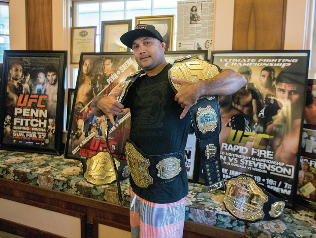 2707331_web1_1-BJ_Penn_with_UFC_Belts_2.jpg