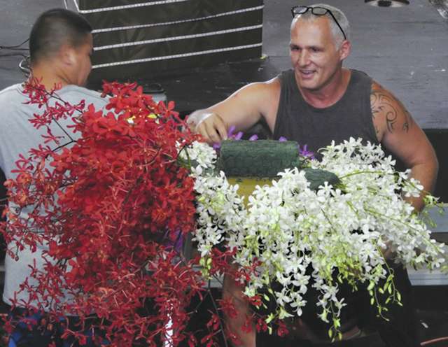 3899944_web1_Matthias-arrangiing-flowers.jpeg