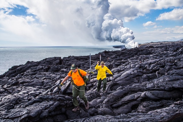 4711550_web1_960_Eruption-Crew-Rangers-Rob-Ely-and-John-Moraes-replace-white-rope-line-marking-closed-coastal-cliffs.jpg