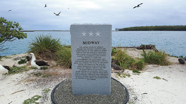 5320466_web1_Midway-Memorial-Marker-and-Laysan-Albatross-on-Midway-Atoll.jpg