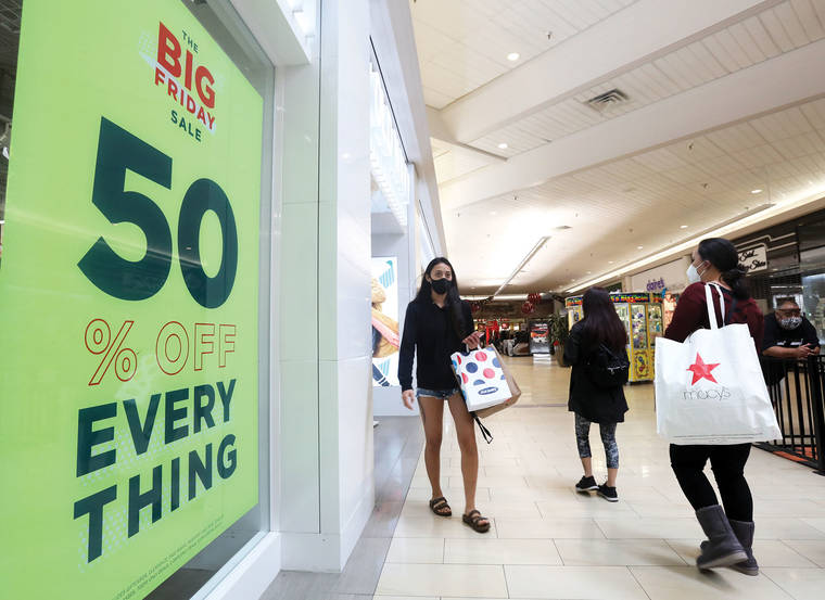 Virus keeps Black Friday crowds thin, shoppers shift online