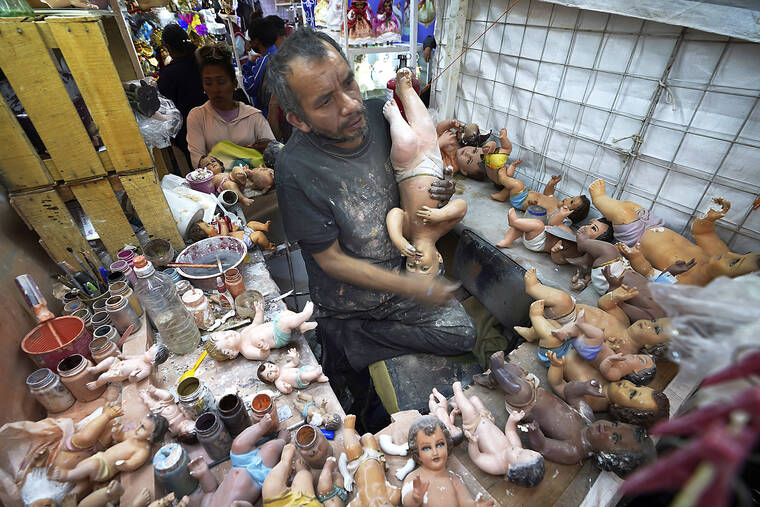 Broken baby Jesus statues flood restorers ahead of feast day