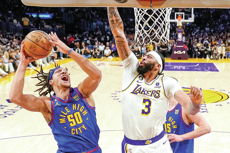 Jokic leads Denver Nuggets past LeBron's Lakers 113-111, into