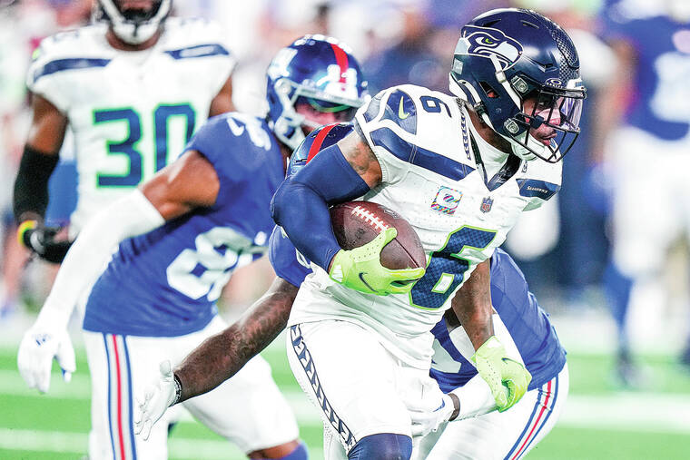 Rookie Devon Witherspoon scores on 97-yard pick-6 as Seahawks' defense  leads Seattle over Giants