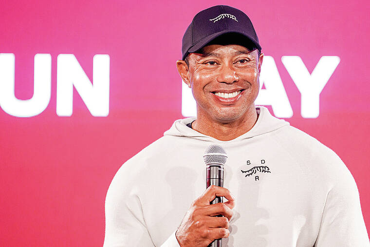 Tiger Woods starts a new year with a new look. Sun Day Red is his new ...