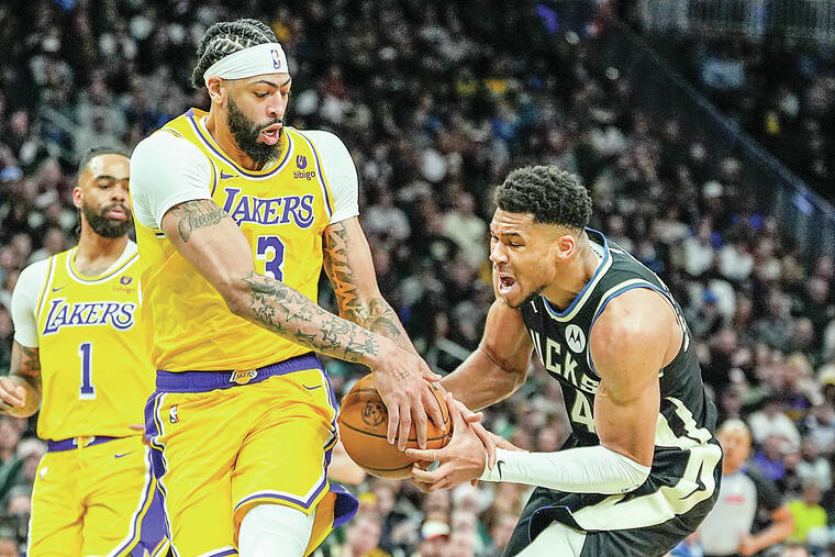 Reaves’ triple-double, tiebreaking 3 helps rally Lakers past Bucks in 2OTs without LeBron James